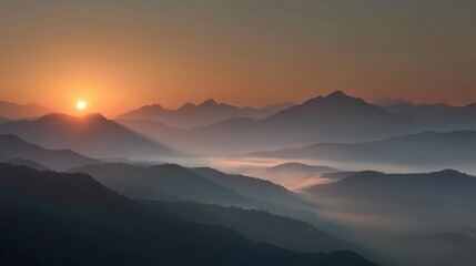 Obraz premium Sunrise over mountains with mist.
