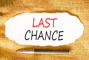 Last chance symbol. Concept word Last chance on beautiful white paper. Beautiful canvas background....