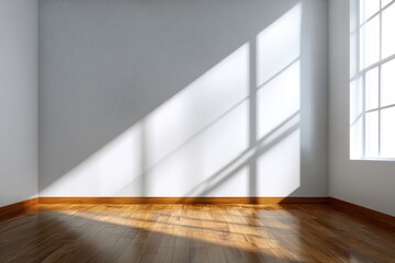 Sunshine illuminates an empty room with soft shadows creating a warm atmosphere during the morning hours