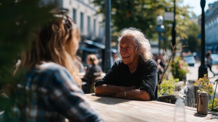 Smiling woman enjoys conversation at outdoor cafe on a sunny day.