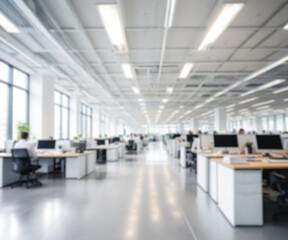 Out of focus, blurred background of modern office with employees working on computers. Shallow depth of field creates a modern and abstract background for business concepts, technology