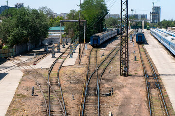 Railway, Multiple passenger carriages positioned on adjacent tracks, semaphore signal, visible...