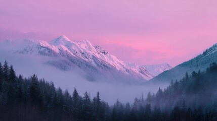 a pink sky over a mountain range with a few trees