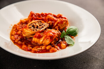 Stuffed cabbage tomato sauce with beans meat, cabbage, fresh delicious gourmet food background on the table rustic food top view copy space