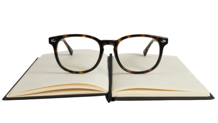 Glasses resting on open notebook