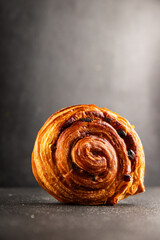 Raisin bun sweet pastry dessert puff pastry fresh delicious gourmet food background on the table rustic food top view copy space