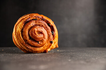Raisin bun sweet pastry dessert puff pastry fresh delicious gourmet food background on the table...