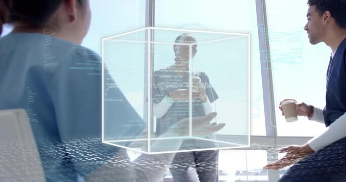 Tech team holding coffee and analyzing wireframe cube materializing with code visualizing data