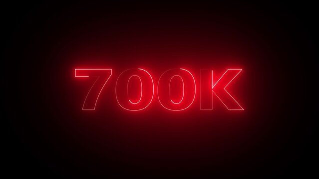 Bright Red Neon 700 K Text Illuminated Against a Dark Background 700k seven hundred thousand