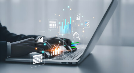 Businessman analyzing financial data and business growth using laptop computer