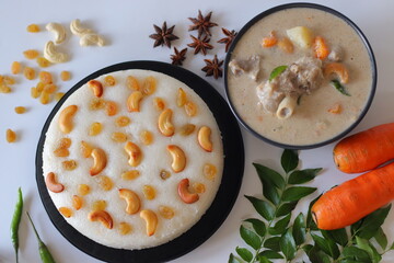 Kerala style mutton stew paired with vattayappam, a steamed rice cake topped with raisins and cashews