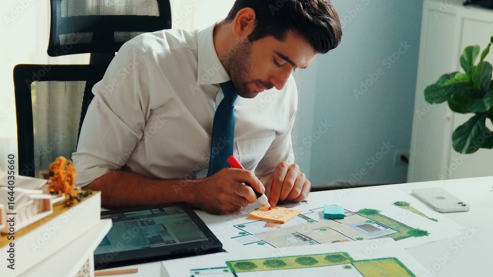 Aufkleber top view of project manager writing house idea on sticky notes while looking plan at tablet. aerial 