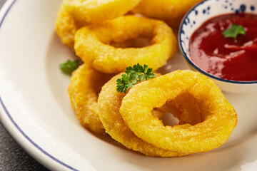 Colmar rings fried food fries fast food crispy appetizer fresh delicious gourmet food background on the table rustic food top view copy space