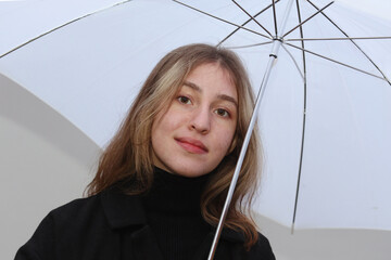 Portrait of a girl with an umbrella.