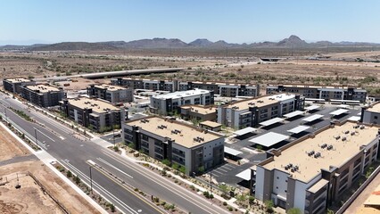 Fototapeta premium Aerial view of modern apartment complex in desert.