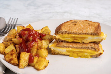 egg melt sandwich with home fries