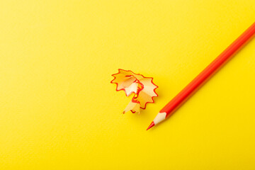 Pencil sharpener on bright colored background. Pencil and pencil shavings. Stationery. School...