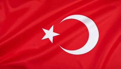 Obraz premium Turkish flag with a white star and crescent on a red background.
