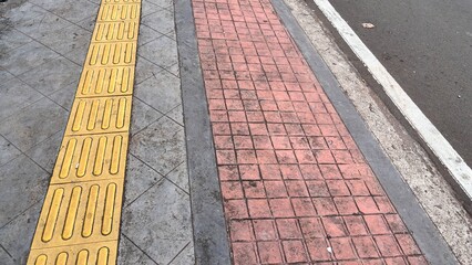 Tactile Paving and Red Brick Sidewalk Urban Accessibility Design Streetscape Detail.