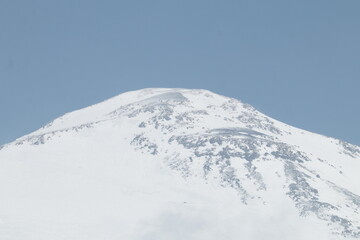 Elbrus slopes covered with ice and snow on a summer day in early August