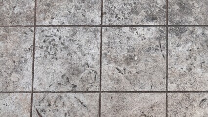 Grungy Concrete Tiles Texture with Dark Grout Lines.
