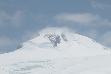 Elbrus Western summit in the clouds early August
