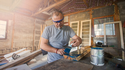 Male Carpenter Working with Wood
