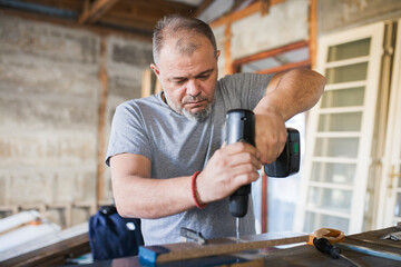 Male Carpenter Working with Wood