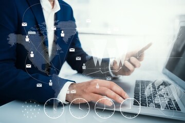 Global Business Connection: Man Analyzing Financial Data with Laptop and Digital Overlay
