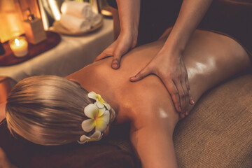 Closeup woman customer enjoying relaxing anti-stress spa massage and pampering with beauty skin...
