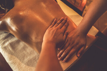 Closeup woman customer enjoying relaxing anti-stress spa massage and pampering with beauty skin...
