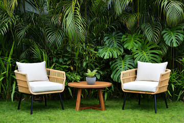 Outdoor Living Space with Rattan Chairs and Lush Tropical Greenery Inviting Relaxation and Serenity