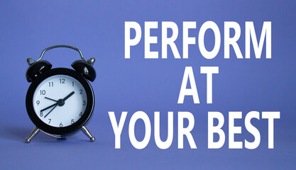 Perform at your best symbol. Beautiful purple background with alarm clock. Business and Perform at your best concept. Copy space.