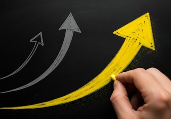 Hand drawing a bright yellow upward trending arrow over fainter grey arrows on a dark background symbolizing growth