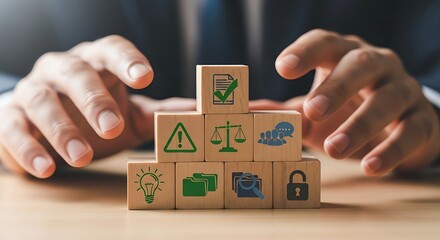 Hands hovering over wooden blocks symbolizing business risk management and security measures