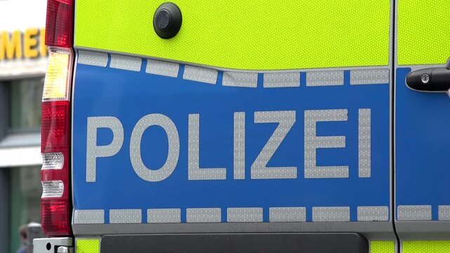 Police vehicle parked on side of road with flashers on 4k