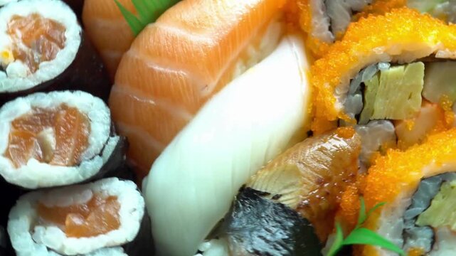 Close up of fresh and delicious salmon nigiri sushi with tobiko and maki