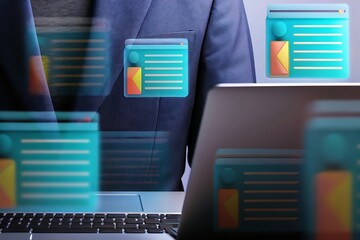 Man in suit using futuristic holographic interface with glowing data displays and charts