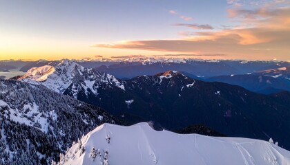 Aerial View of Snowy Mountain Ridge at Sunrise