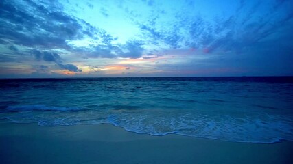 Beautiful sunset over the sea with waves crashing on the beach at twilight - Powered by Adobe