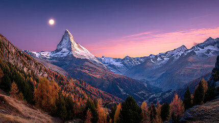 Majestic snow capped peak under a twilight sky with autumn foliage mountain
