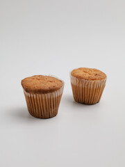 Vanilla cupcake on white background