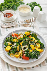 zucchini kale tomato saute sprinkled with sesame