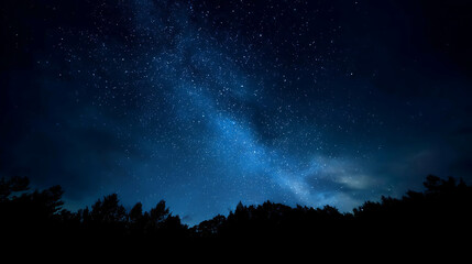 Vast deep blue night sky filled with countless sparkling stars and the glowing Milky Way above a dark forest silhouette