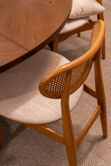 Wooden chair with handmade fabric in front of a round table