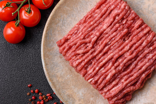 Raw minced beef or pork, ground meat for burgers. Raw minced meat - Powered by Adobe
