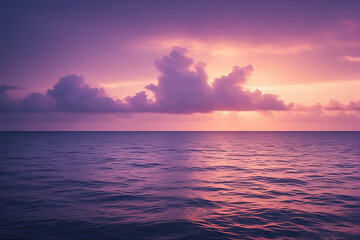 Obraz premium Orange light from the rising and setting sun reflects beautifully on the water of the ocean, painting the clouds and sky in shades of red and blue
