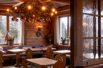 Cozy alpine restaurant interior in winter Austria