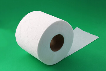 Toilet paper roll on a green background