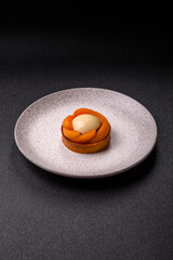 Pie, sweet round tart with apricot pieces, cream and nuts. Sweet tart with peach